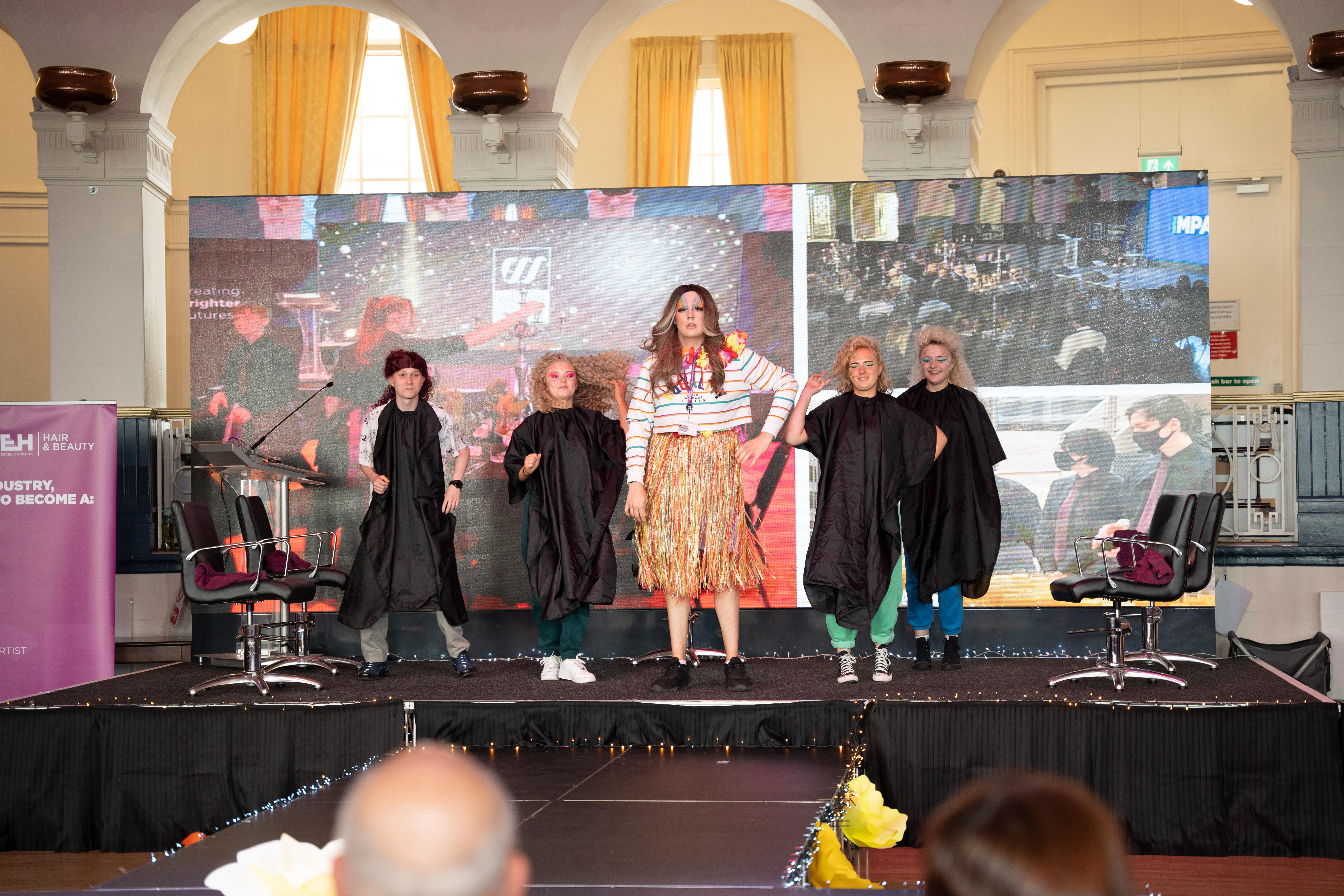 students preforming on stage at the faculty of service industries and education awards