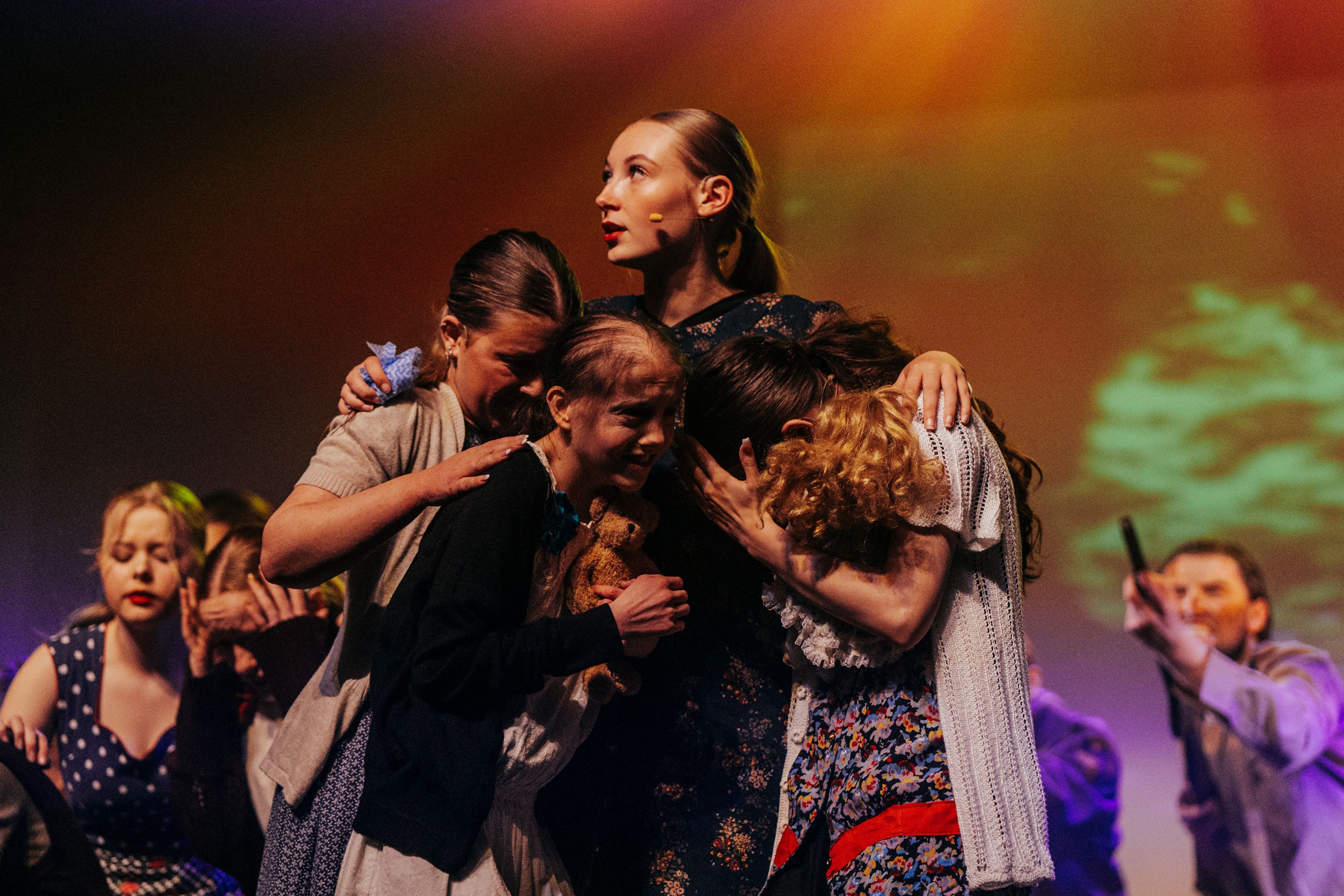 Students huddled together from the dress rehearsal