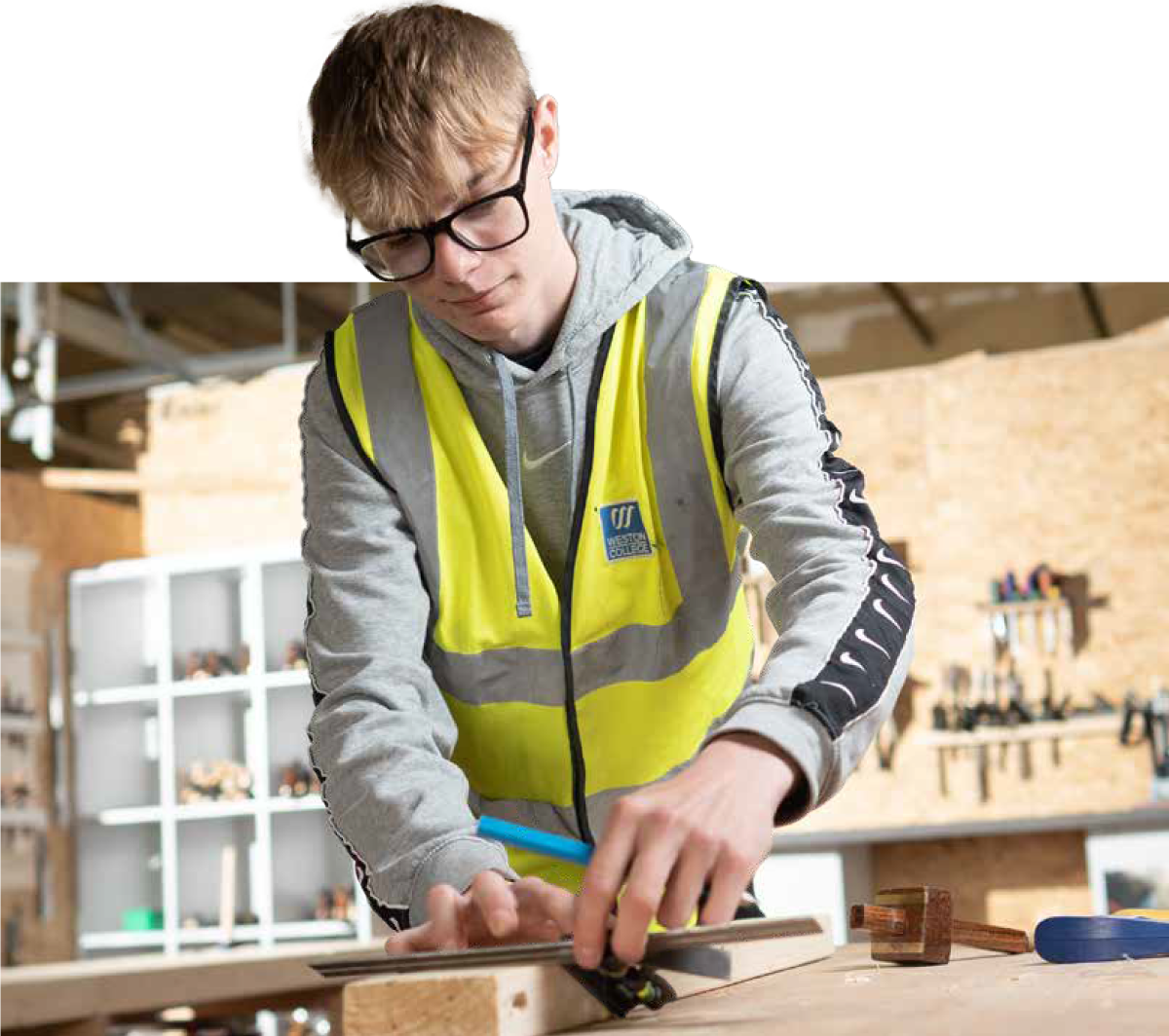 construction student shaving wood