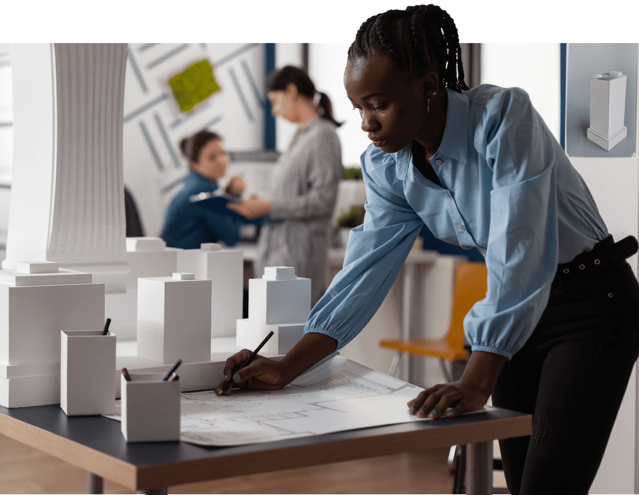 women looking at building model