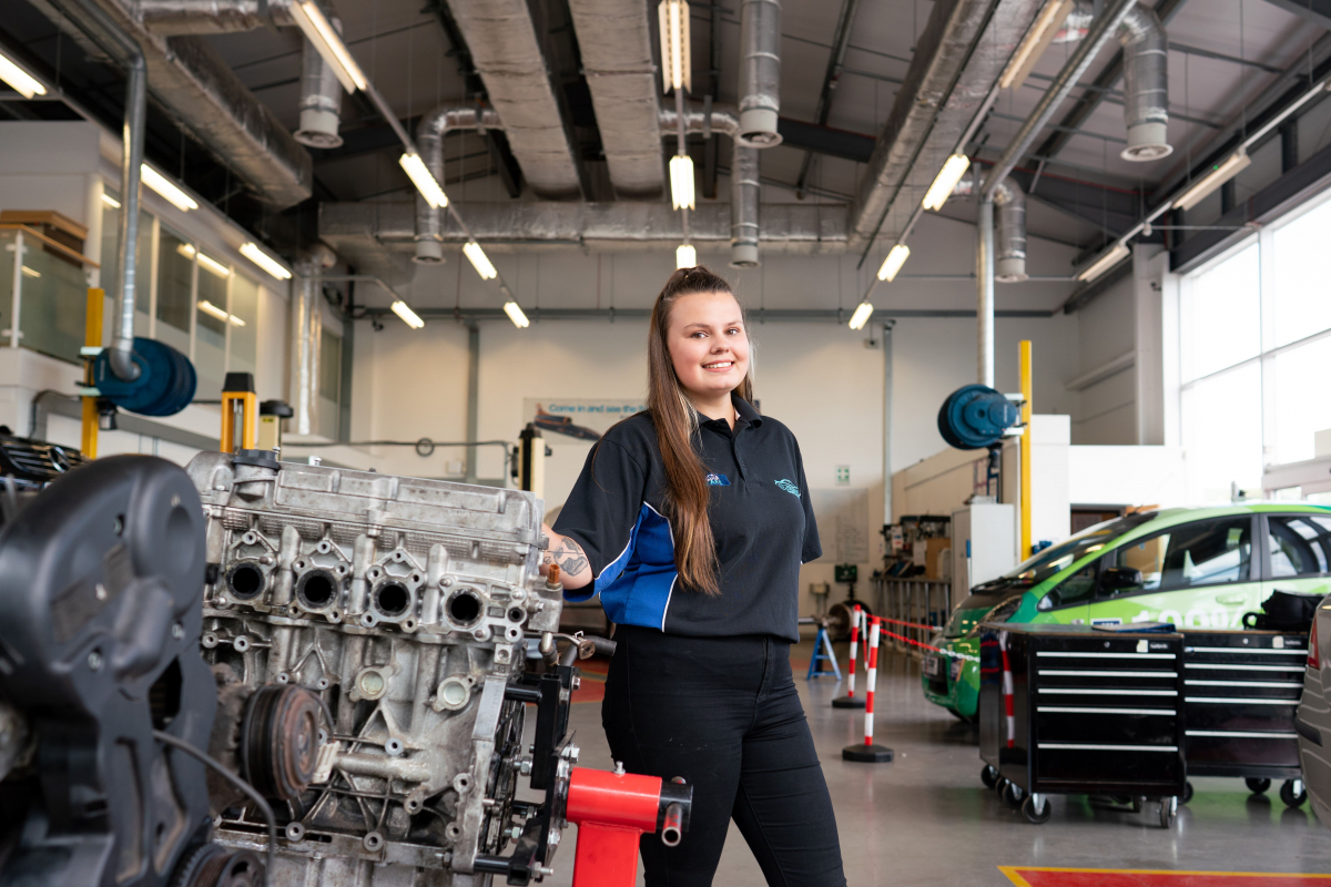 girl poses in motoring facilities