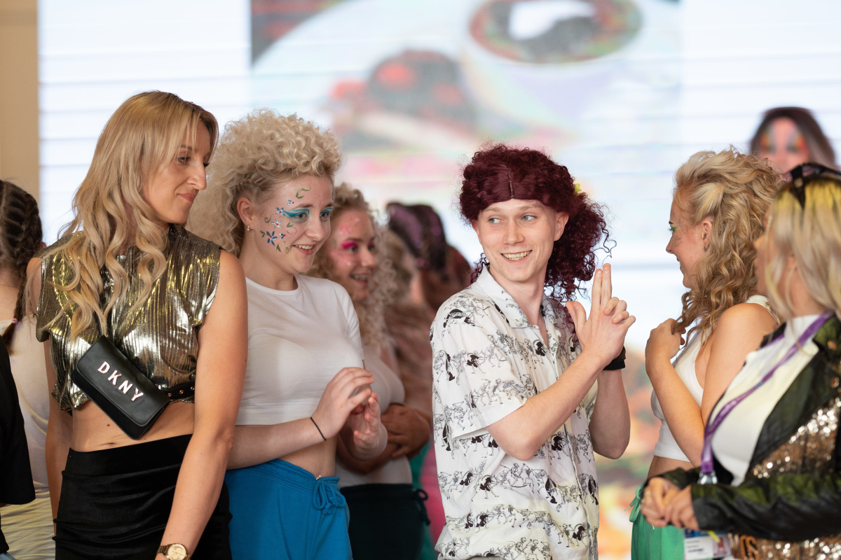 students preforming on stage at the faculty of service industries and education awards 
