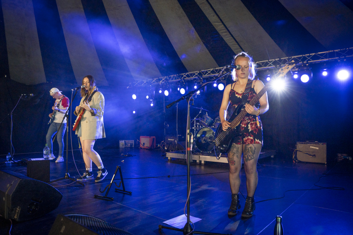 a band on a stage playing instruments 