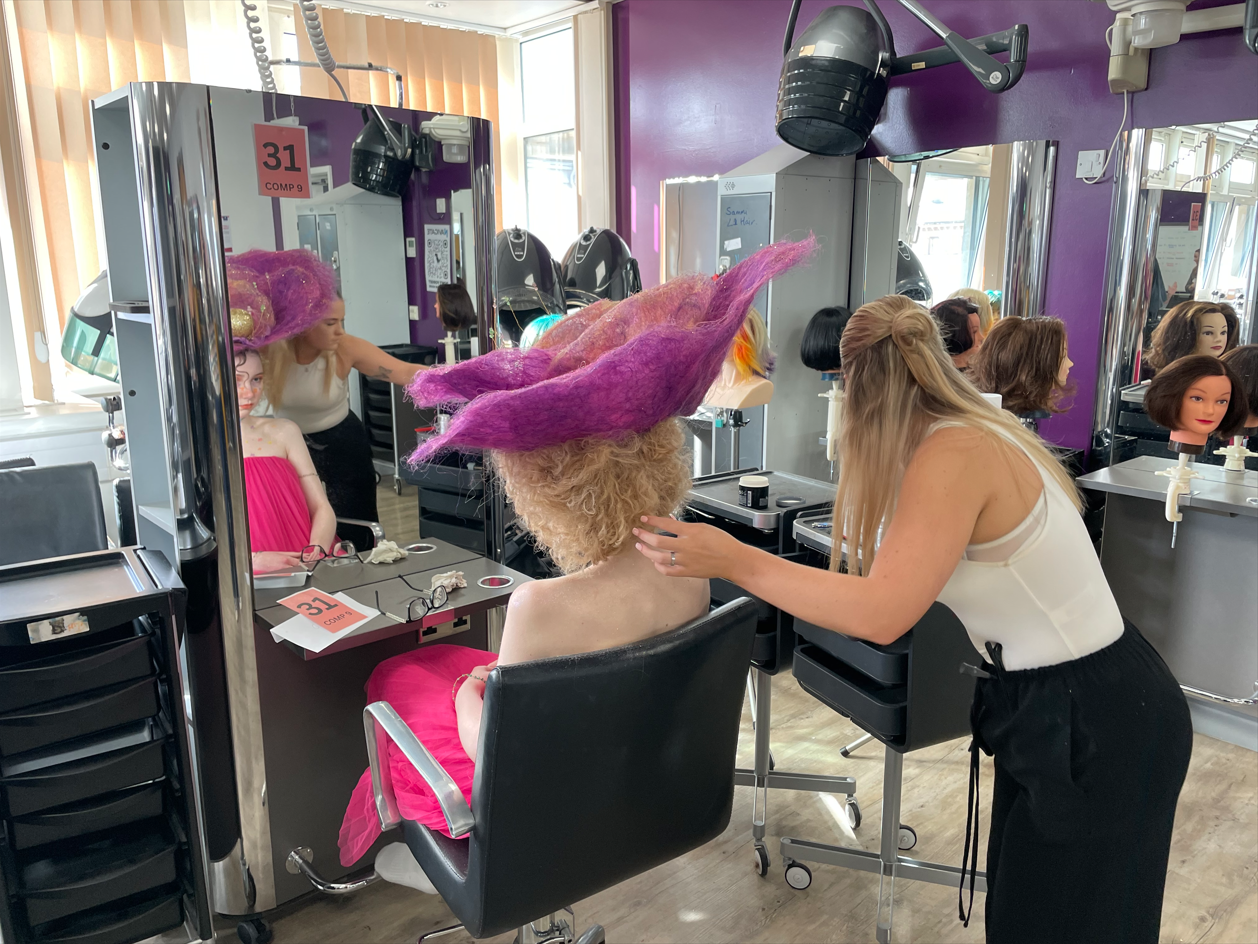 Student working on the fantasy hairdressing competition