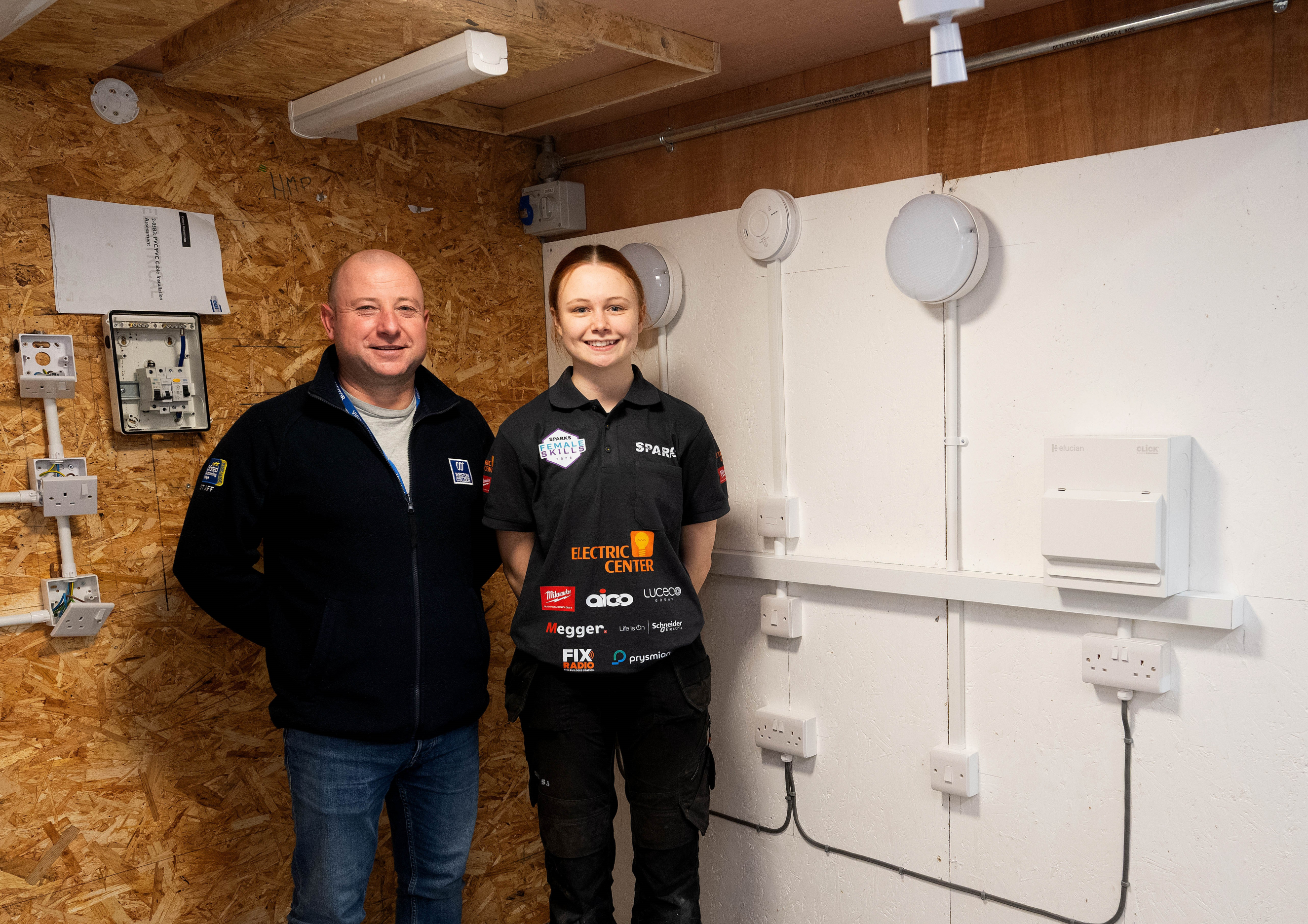 Gracie and her lecturer, Andy, standing next to her final installation