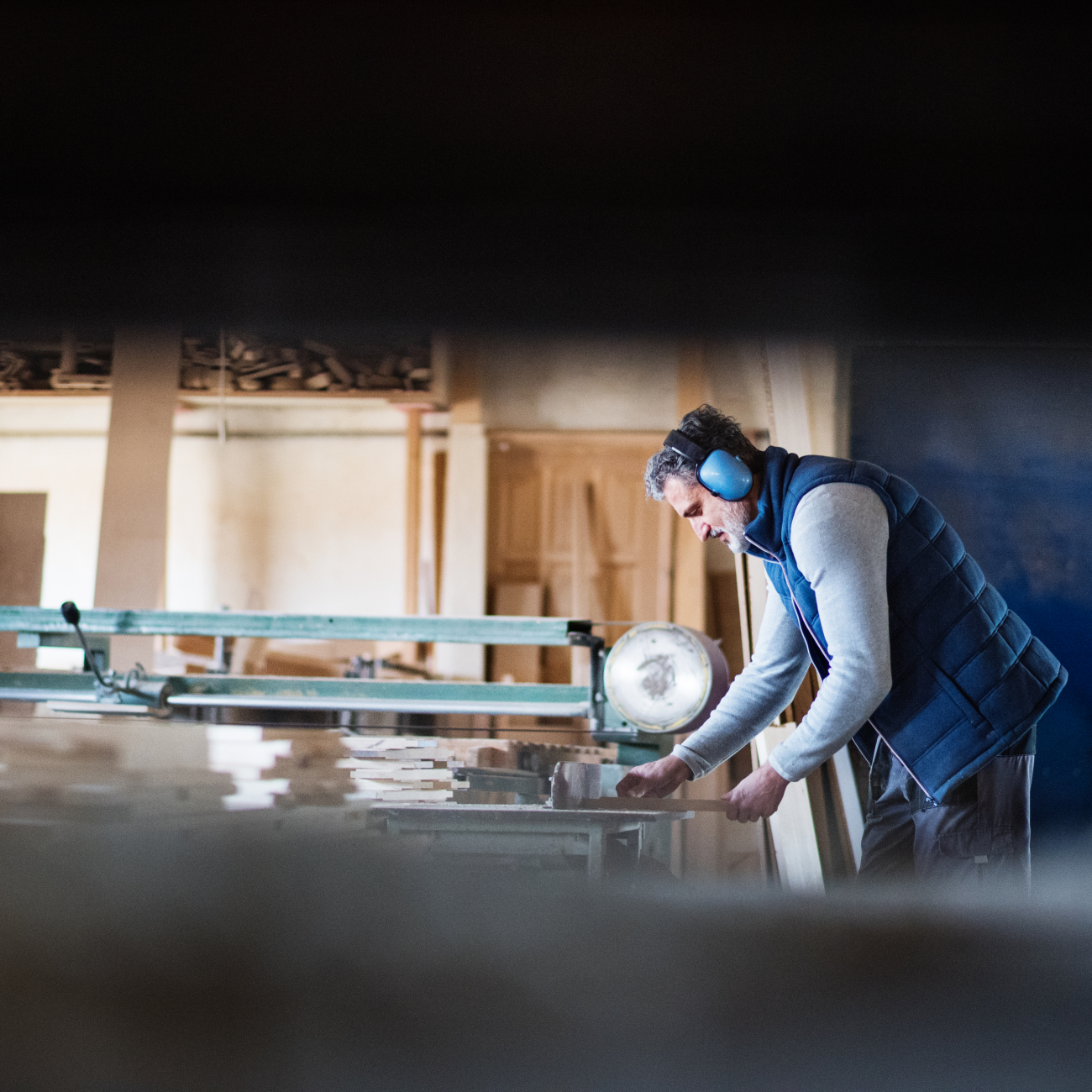 Man working with wood for his carpentry task