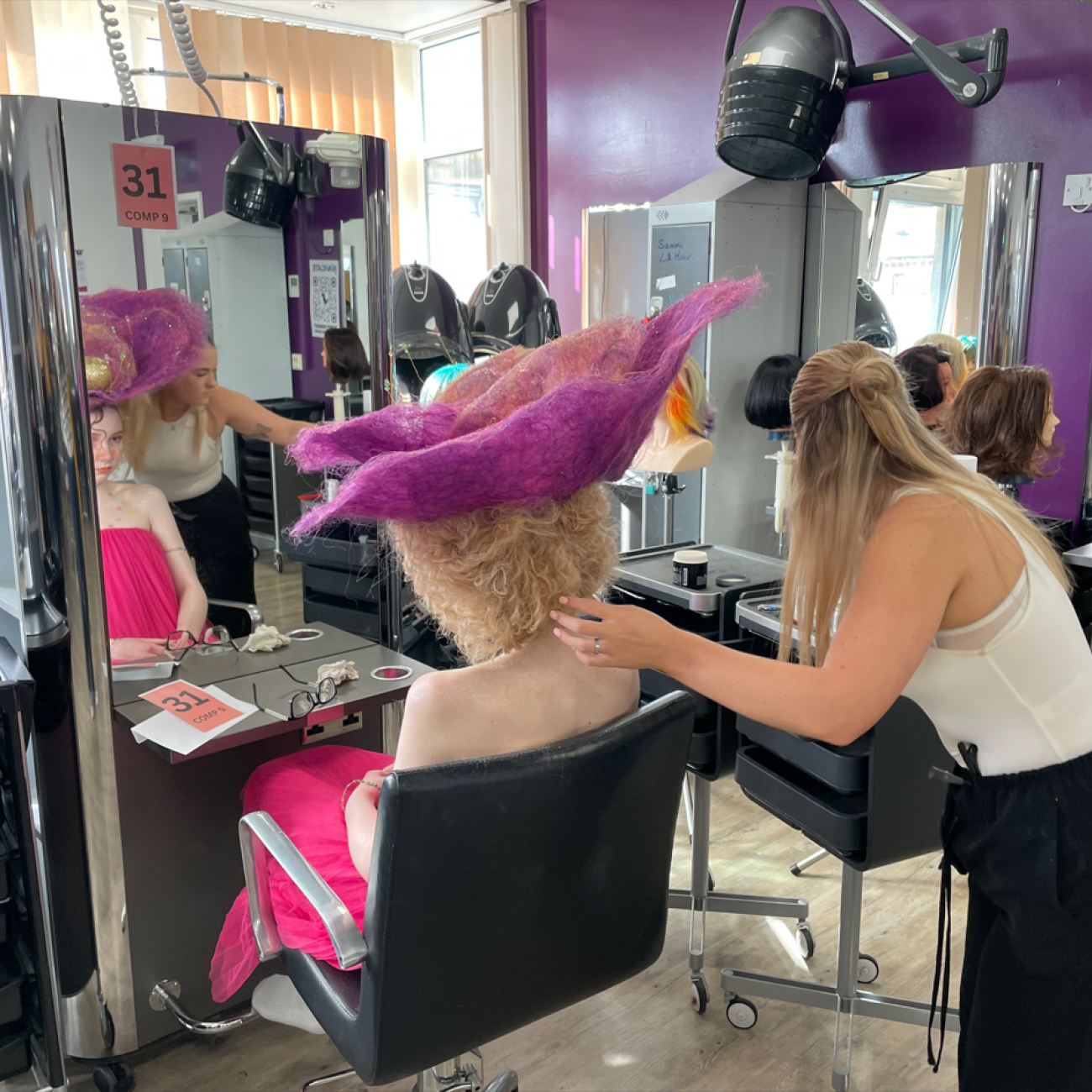Student working on the fantasy hairdressing competition