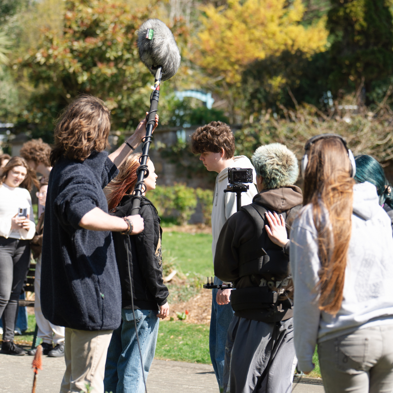 Media students filming a project with Performing Arts students