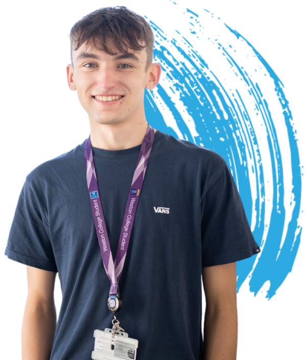 male weston college student stands smiling at the camera